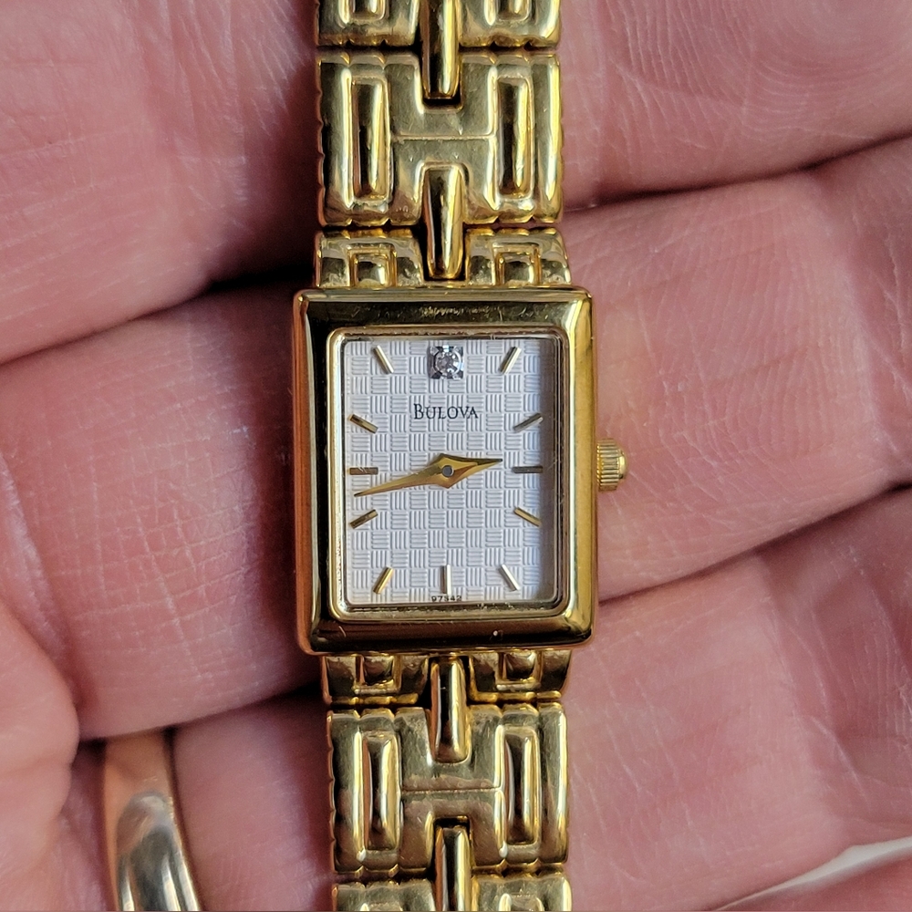 Ladies Bulova Gold tone tank watch  Diamond Accent &waffl dial.